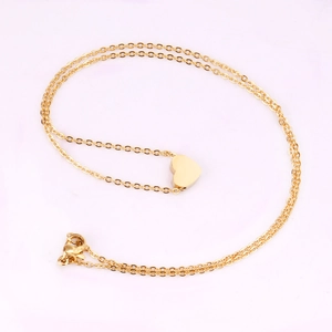Elegant gold heart pendant necklace for women with polished finish on a delicate chain