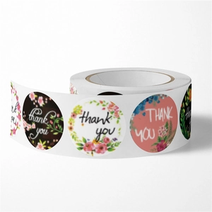 Roll of floral thank you stickers with various botanical designs for wedding decoration
