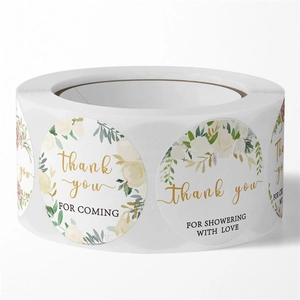 Macro detail of round floral stickers with cream roses and thank you for coming text
