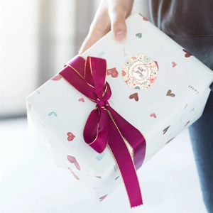Floral Thank You stickers on a white gift box with elegant ribbons for weddings