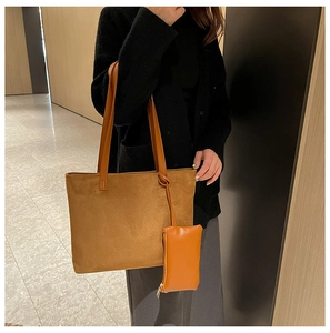 Detailed view of brown faux suede tote bag set with matching small zipper pouch