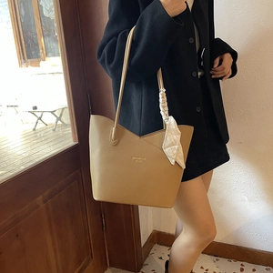Chic khaki pebbled leather shoulder tote bag with decorative white silk scarf detail