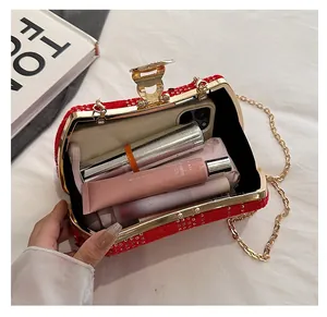 Interior view of red sequin evening bag showing space for phone and makeup items