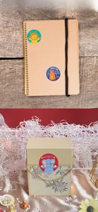 Cartoon animal reward stickers for kids shown on notebook and gift box packaging