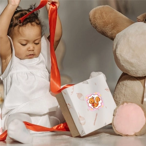 Cute animal stickers on gift box with orange ribbon for kindergarten reward labels