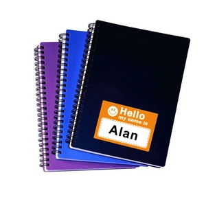 Three-pack spiral notebooks in purple, blue, and black with personalized name label