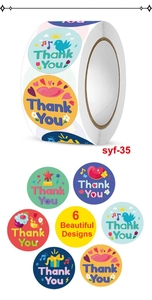 Detail of 6 colorful round Thank You stickers with bird and heart designs for gift boxes