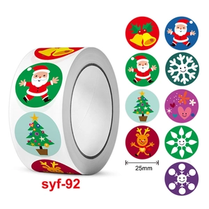 Roll of 25mm Christmas stickers with Santa and reindeer designs for festive decoration