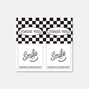Detail of black and white checkerboard Thank You and Smile rectangle packaging stickers