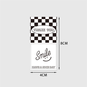 Checkerboard pattern rectangle thank you stickers with smile icon for gift packaging labels