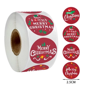 Detail view of 2.5cm Christmas stickers roll with festive Merry Christmas patterns