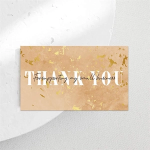 Detail of marble texture thank you card with gold foil for small business support