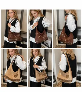 Detail view of large vintage motorcycle tote bag with metallic zippers and adjustable straps