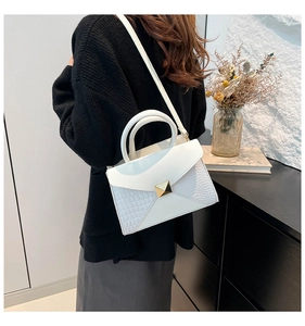 White minimalist square crossbody bag with crocodile texture and gold pyramid stud detail