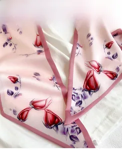 Detailed view of the neat inner seam edges on the pink rose silk scarf fabric