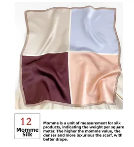 Detail showing 12 momme mulberry silk scarf texture with color-block stitching patterns