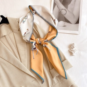 French style horse pattern twilly silk scarf styled on a beige suit collar