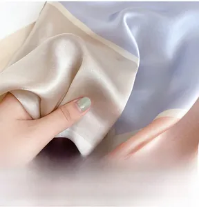 Detailed view showing the soft texture and vibrant digital print of silk square scarf