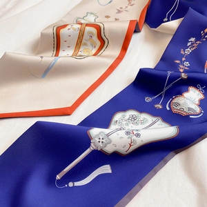 Detail of silk skinny scarves featuring traditional Chinese floral and fan patterns