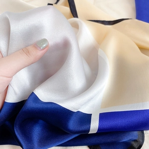 Detailed view of the smooth drape and silk texture of this multi-color silk scarf