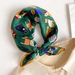 53cm mulberry silk scarf featuring green cat print tied on a beige shirt collar