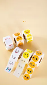 Macro shot of colorful emoji reward stickers in rolls featuring various smiley faces