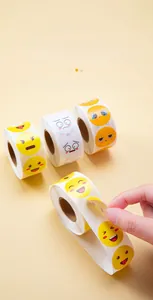 Detail view of easy-to-peel waterproof smiley face reward sticker rolls for kids