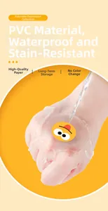 Close-up of waterproof PVC smiley face stickers showing durability under running water