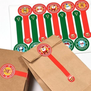 Festive long Christmas sealing stickers with Santa and reindeer on kraft paper bags