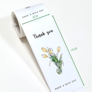 Detail showing white 6x15cm tulip stickers with Thank You text and floral print