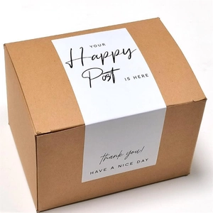Detail of white tulip rectangular seal sticker on a brown corrugated gift box