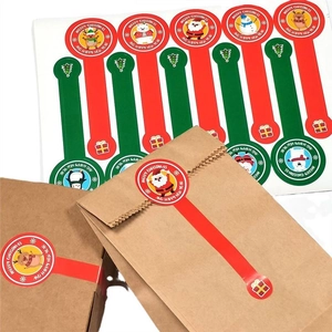 Cartoon Christmas sealing stickers with Santa and reindeer on kraft gift bags