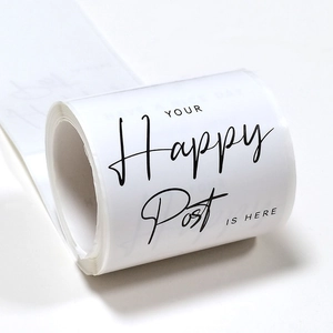 Roll of white tulip rectangular seal stickers with black artistic typography for gift packaging