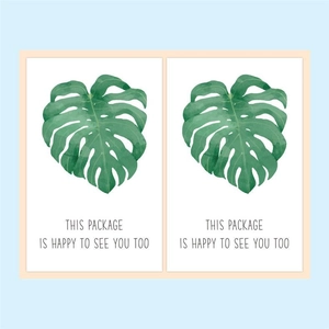 Detail of green leaf rectangle stickers with 'Happy to see you too' greeting text