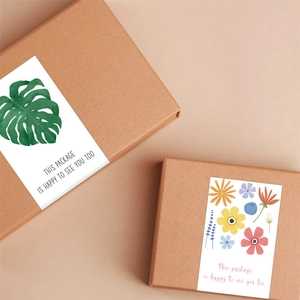Green leaf and floral rectangular stickers on kraft gift box with warm greeting text