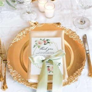 Golden charger plate with vintage embossed edge for elegant wedding table decoration