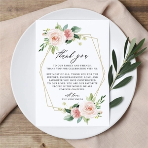 Elegant floral wedding thank you card on white plate with olive leaf decoration