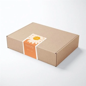 Macro detail of a corrugated gift box with a decorative orange daisy seal sticker