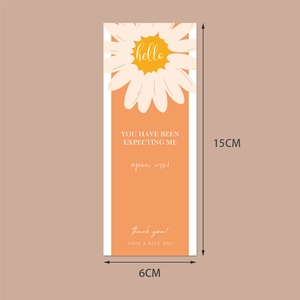 Minimalist orange rectangular adhesive gift box seal sticker with white daisy and hello text