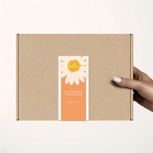 Orange rectangular packaging stickers with white daisy design for gift box sealing