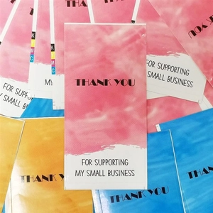 Close-up of colorful watercolor Thank You cards and labels for gift package sealing