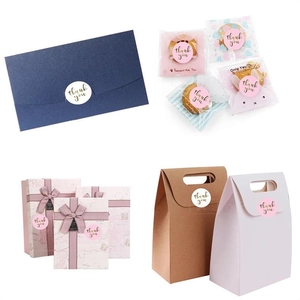 Detailed views of holographic Thank You stickers on gift boxes, envelopes and bags