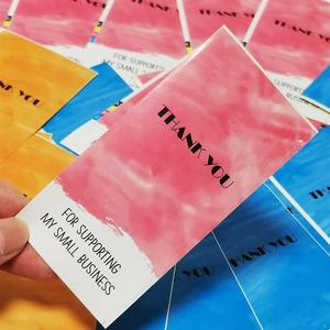 Close-up of watercolor thank you cards for small business packaging in multiple colors
