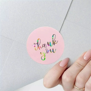 Holographic Thank You stickers on pink background used for elegant gift envelope sealing