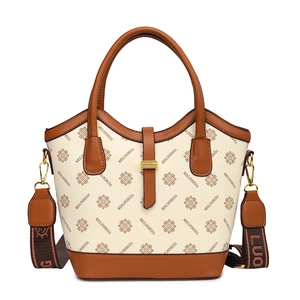 Sac à main vintage avec garniture en cuir marron et large bandoulière brodée