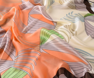 Detailed macro shot of abstract floral print silk scarf with premium rolled edges