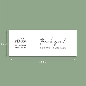Detailed view of white rectangular 15x6cm thank you label for gift box packaging