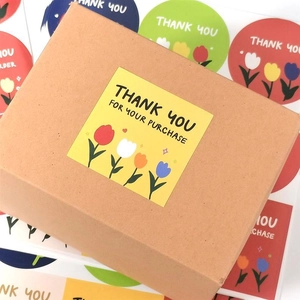 Square tulip thank you stickers on kraft mailer box for professional packaging aesthetics