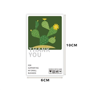 Detail of 10x6cm cactus thank you label with handle with care shipping icons