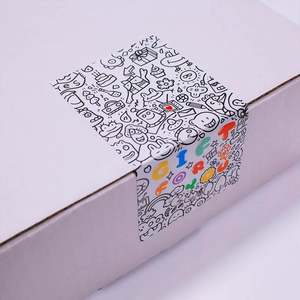 White gift box with black and white doodle stickers and Gift For You colorful lettering
